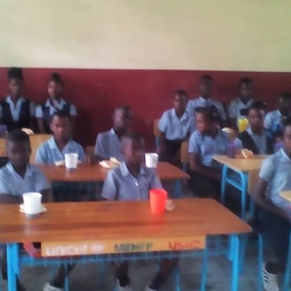 A group of students sitting at desks in a classroom.