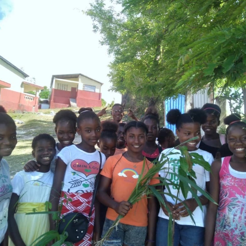 A group of children standing next to each other.