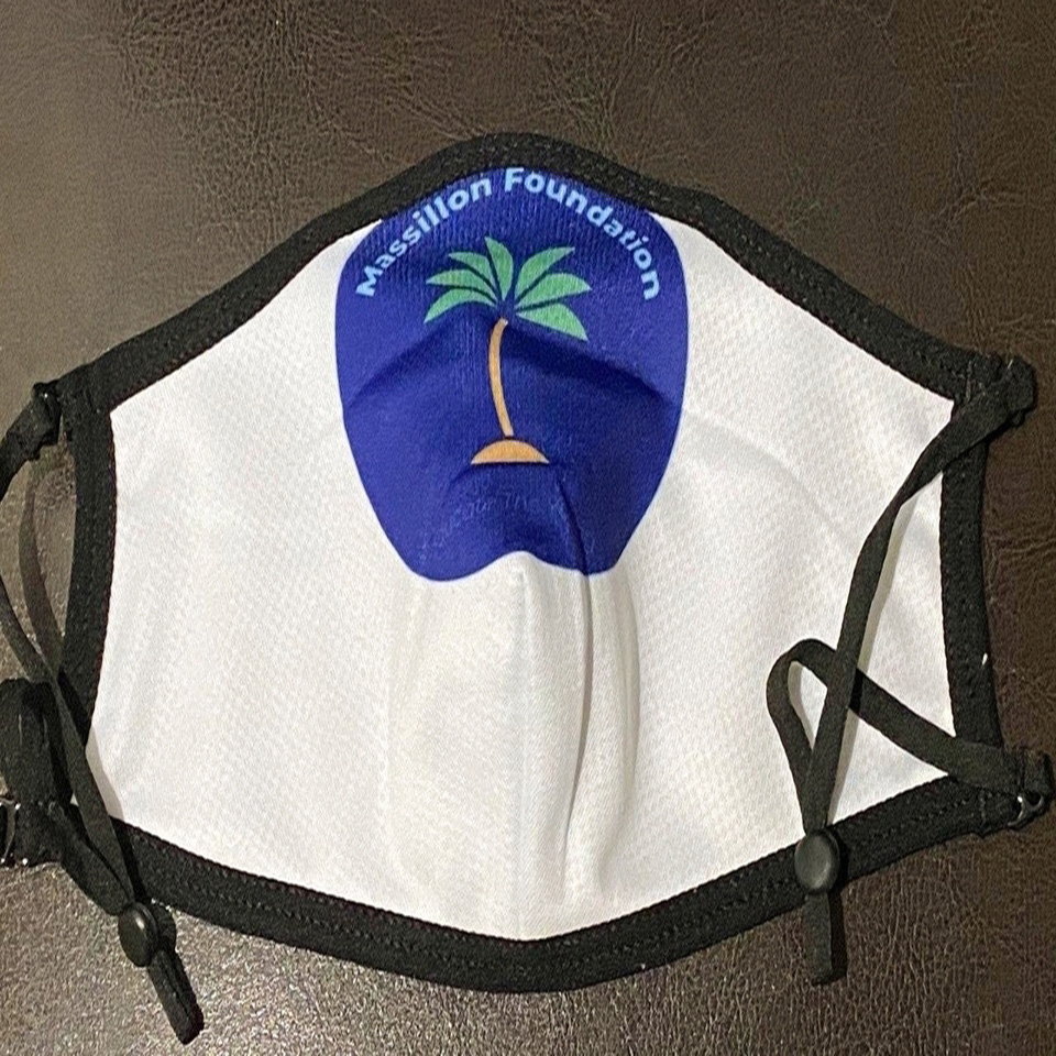 A white face mask with a palm tree on it.