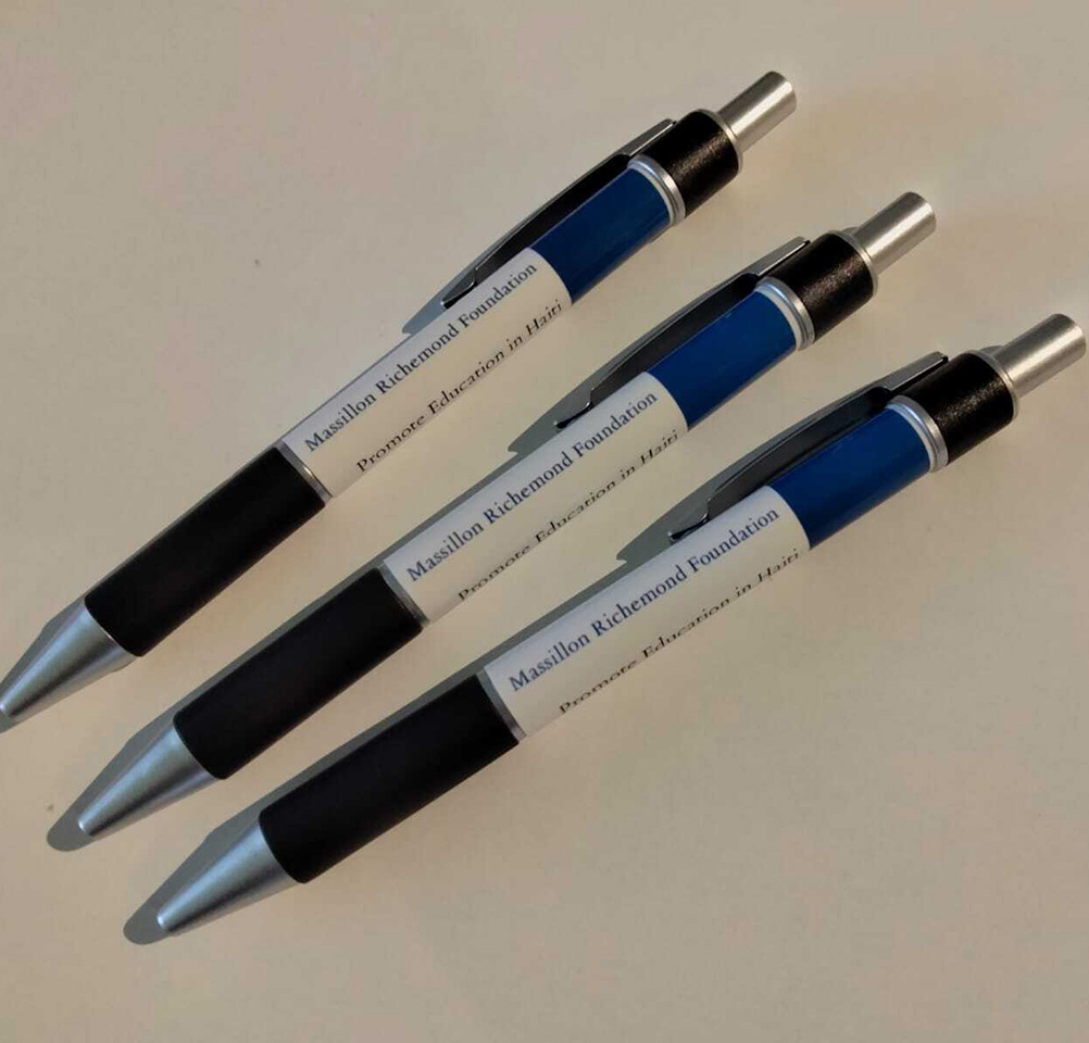 Three pens are shown on a table.