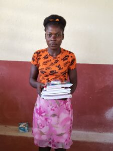 A woman holding papers in her hands.