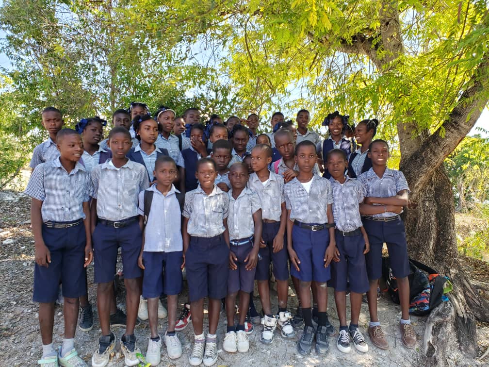 A group of young people standing next to each other.