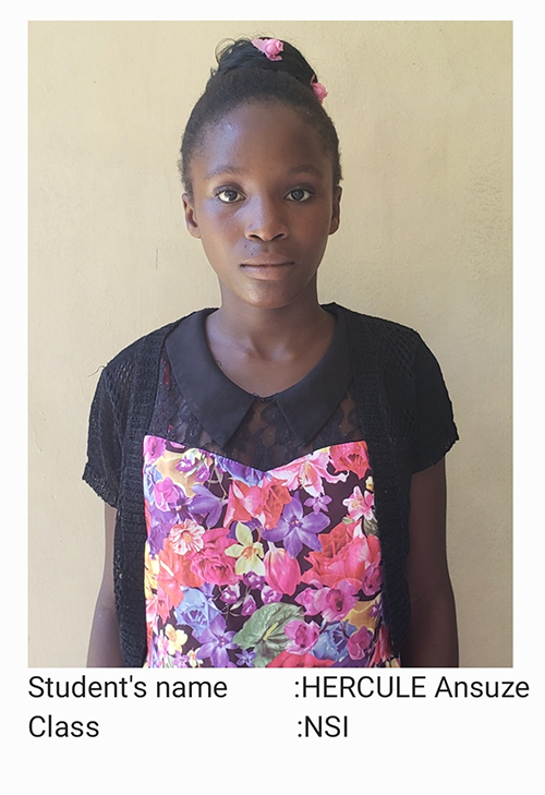 A young girl wearing an apron and standing in front of a wall.