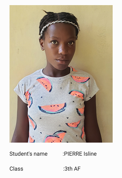 A young girl wearing a watermelon shirt.