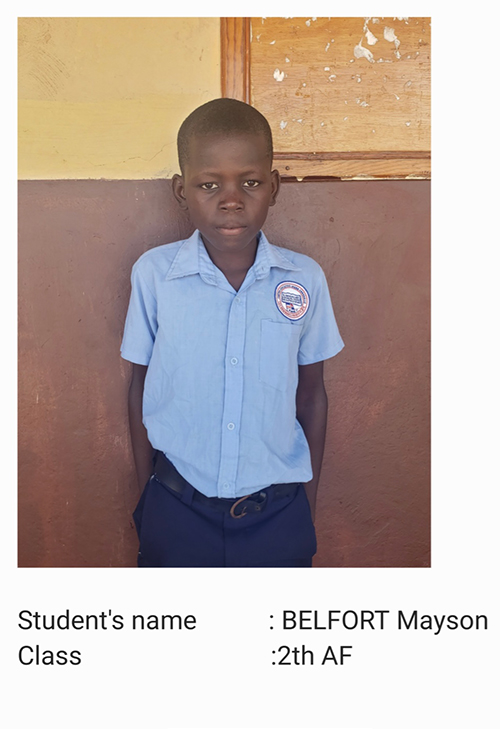 A young boy in blue shirt and black pants.